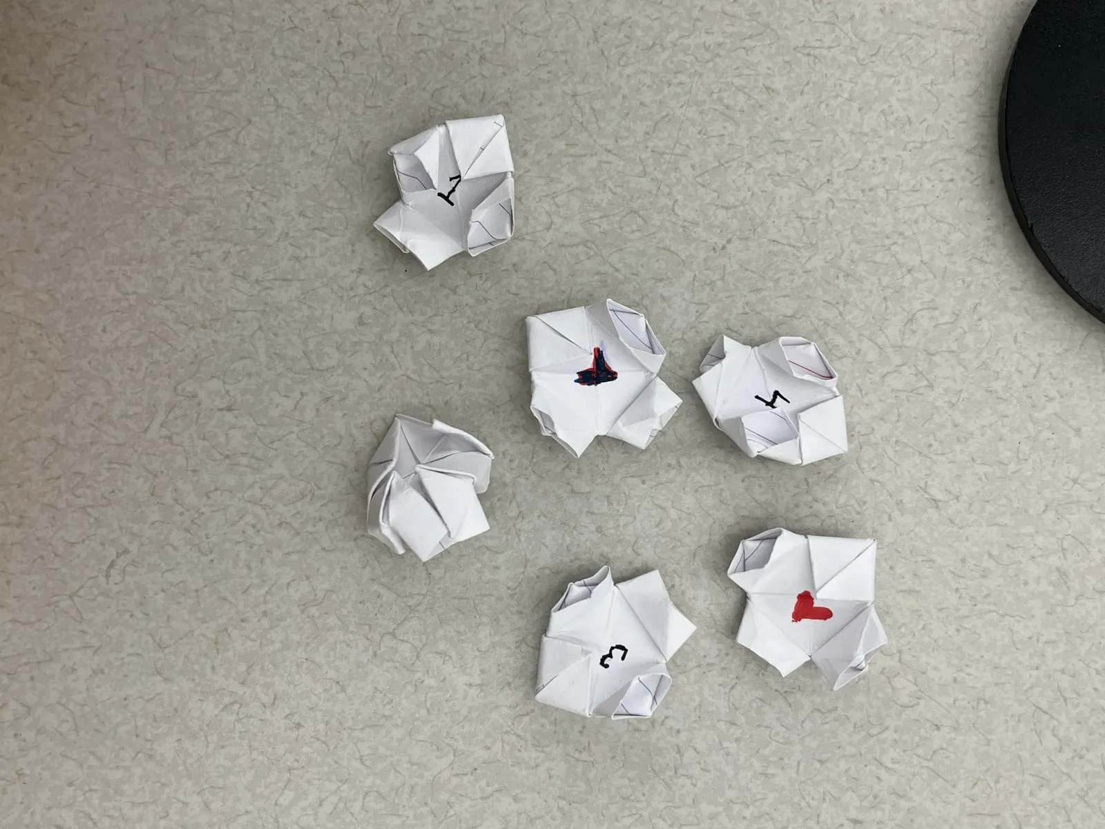 The origami player pawns, which really do look like fortune tellers