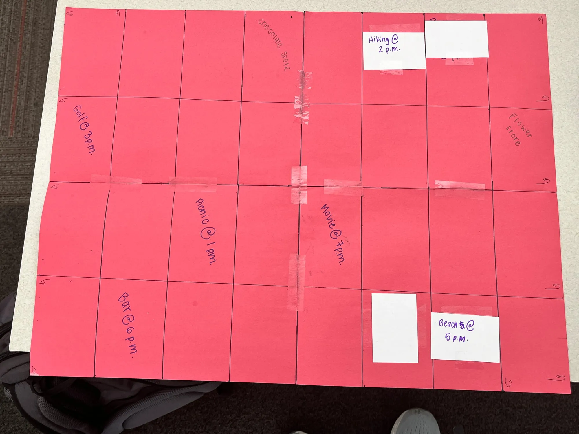 The first paper prototype: red construction paper with date spots taped on