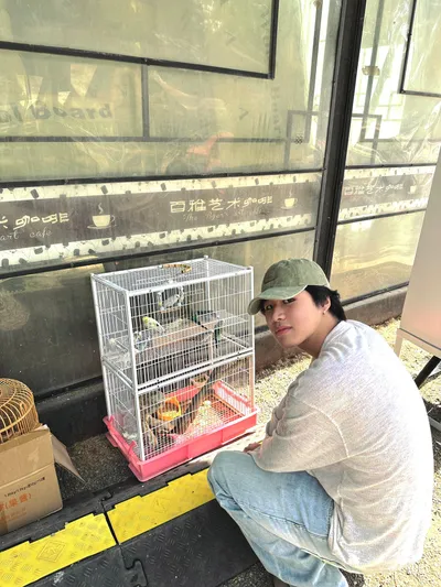 At a cafe with a birdcage