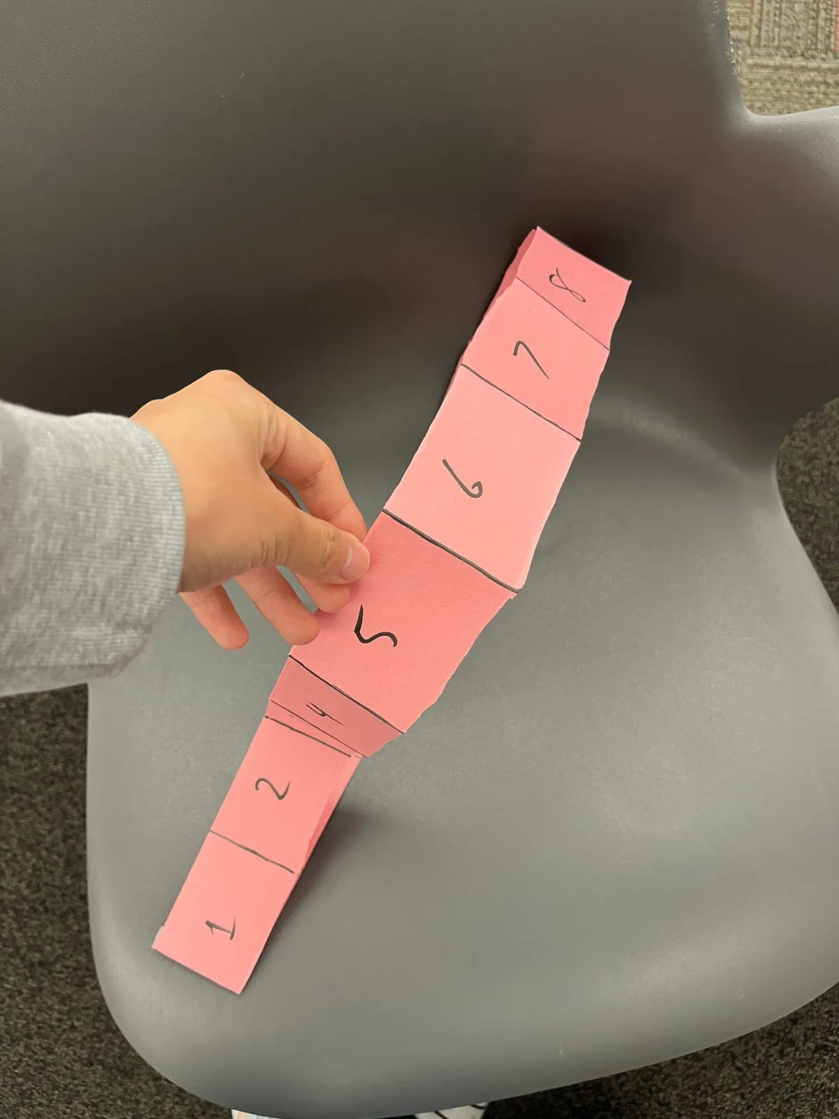 The time belt: a loop of paper with an hour on each panel